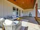 Inviting covered patio area with stylish outdoor seating and a wood paneled ceiling offers a relaxing retreat at 1160 Springlake Rd, York, SC 29745