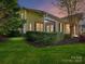 Scenic back exterior with screened porch and lush greenery, perfect for relaxation and outdoor enjoyment at 11705 Silverado Ln, Charlotte, NC 28277