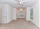 Spacious carpeted bedroom features natural light and a double door closet at 11705 Silverado Ln, Charlotte, NC 28277