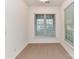 Simple bedroom with neutral carpet, bright windows, and ample natural light at 11705 Silverado Ln, Charlotte, NC 28277