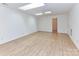 Bright bedroom features hardwood floors, a ceiling fan, and natural light from the skylights at 11705 Silverado Ln, Charlotte, NC 28277