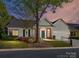 Charming single-story home with a well-maintained lawn and attached garage, perfect for easy living at 11705 Silverado Ln, Charlotte, NC 28277