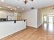 Open kitchen area with white cabinets, sleek countertops, and a view of the well-lit interior space at 11705 Silverado Ln, Charlotte, NC 28277