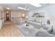 Sunlit living room boasts skylights, modern decor, neutral colors, and sleek, contemporary furniture at 11705 Silverado Ln, Charlotte, NC 28277