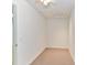 Small room with an access panel in the ceiling and neutral carpeting at 11705 Silverado Ln, Charlotte, NC 28277