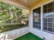Cozy screened-in porch offering views of mature trees and the well-manicured landscape at 11705 Silverado Ln, Charlotte, NC 28277