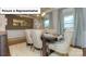 Elegant dining room with a table set for a meal, neutral color palette and lots of light at 120 Autumnwood Rd, Troutman, NC 28166