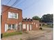 Brick multi-unit home with white framed windows and several entrances along the front at 1205 W Bank St, Salisbury, NC 28144