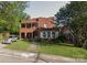 Two-story brick home featuring a covered porch and a well-maintained front yard at 1205 W Bank St, Salisbury, NC 28144