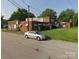Multi-unit brick home with small lawns and off-street parking space at 1205 W Bank St, Salisbury, NC 28144