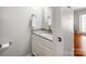 Cozy half bathroom with granite countertop, modern fixtures and white vanity at 1217 Green Oaks Ln # K, Charlotte, NC 28205