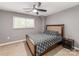 Bedroom with ceiling fan, natural light and a comfortable bed at 1217 Green Oaks Ln # K, Charlotte, NC 28205