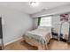 Bedroom with cozy carpet, and a soft comfortable bed with natural light at 1217 Green Oaks Ln # K, Charlotte, NC 28205
