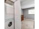 Bedroom with carpet, neutral paint and a clothes washer and dryer behind a closet door at 1217 Green Oaks Ln # K, Charlotte, NC 28205