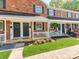 Charming brick townhomes with cozy porches and well-maintained landscaping at 1217 Green Oaks Ln # K, Charlotte, NC 28205