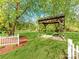 A nice gazebo in a lush garden setting; perfect for relaxing at 1217 Green Oaks Ln # K, Charlotte, NC 28205