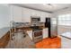 Well-lit kitchen featuring granite counters, stainless steel appliances, and modern fixtures at 1217 Green Oaks Ln # K, Charlotte, NC 28205