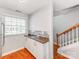 Bright kitchen area with ample cabinetry, granite countertop, and staircase access at 1217 Green Oaks Ln # K, Charlotte, NC 28205