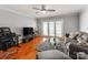 Comfortable living room with hardwood floors, a ceiling fan and a view of the outside at 1217 Green Oaks Ln # K, Charlotte, NC 28205