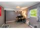 Finished basement room used as office space features carpeting and a window with natural light at 1218 Donna Dr, Shelby, NC 28152