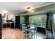 Eat-in kitchen features white cabinets, stainless appliances, and a dining area by the large window at 1218 Donna Dr, Shelby, NC 28152