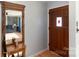 Welcoming entryway with hardwood floors, decorative mirror and wooden door at 1218 Donna Dr, Shelby, NC 28152