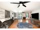 Spacious living room with hardwood floors, a ceiling fan, and modern decor at 1218 Donna Dr, Shelby, NC 28152