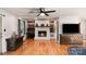 Warm living room featuring a fireplace, hardwood floors, and custom wood accents at 1218 Donna Dr, Shelby, NC 28152
