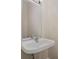 Powder room with pedestal sink, mirror and light fixture at 12925 Windy Lea Ln, Huntersville, NC 28078