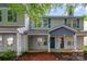 Charming two-story townhome with covered front porch and neutral siding at 12925 Windy Lea Ln, Huntersville, NC 28078