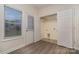 Convenient laundry room with vinyl floor, shelving and backyard access at 12925 Windy Lea Ln, Huntersville, NC 28078