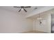 Neutral living room with carpet, ceiling fan, and opening to kitchen at 12925 Windy Lea Ln, Huntersville, NC 28078