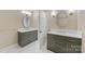 Bathroom with double vanities, mirrors, and tiled floors at 1441 Carmel Rd, Charlotte, NC 28226
