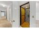 Hallway elevator featuring a folding metal door and wood interior at 1441 Carmel Rd, Charlotte, NC 28226