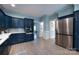 Modern kitchen features custom cabinetry, stainless steel appliances, and a seamless design at 1441 Carmel Rd, Charlotte, NC 28226