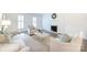 Bright living room with white trim, plantation shutters, fireplace and hardwood floors at 1441 Carmel Rd, Charlotte, NC 28226