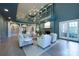 Grand living room showcases a fireplace, balcony, and seamless flow to adjacent spaces at 1441 Carmel Rd, Charlotte, NC 28226