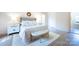 This spacious primary bedroom features a decorative fireplace and great natural light at 1441 Carmel Rd, Charlotte, NC 28226