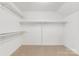 Empty walk-in closet with carpet and built in shelving at 1441 Carmel Rd, Charlotte, NC 28226