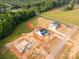 Picturesque aerial shot of new homes under construction, surrounded by a green forest at 1504 Baileys Run, Gastonia, NC 28056