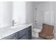Clean bathroom with a modern vanity, tiled shower, and patterned flooring at 1504 Baileys Run, Gastonia, NC 28056