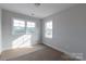 Bedroom with bright window and light walls at 1504 Baileys Run, Gastonia, NC 28056