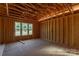 Wood framing reveals the interior with natural light and exposed beams, ready for customization and completion at 1504 Baileys Run, Gastonia, NC 28056