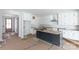 Unfinished kitchen featuring white cabinetry and a gray kitchen island at 1504 Baileys Run, Gastonia, NC 28056