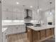 Modern kitchen with a large island, stainless steel appliances, and custom cabinetry, perfect for entertaining at 1504 Baileys Run, Gastonia, NC 28056