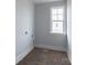 Bright laundry room with white walls, trim, and a window offering natural light at 1504 Baileys Run, Gastonia, NC 28056