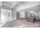 Bright, open-concept living room with coffered ceilings and access to a porch at 1504 Baileys Run, Gastonia, NC 28056