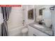 Well-appointed bathroom featuring a shower-tub combo, elegant vanity, and stylish decor at 156 Asmodean Ln, Troutman, NC 28166