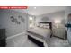 Comfortable bedroom with a queen-sized bed, soft linens, and stylish wall decor at 156 Asmodean Ln, Troutman, NC 28166