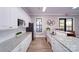 Bright community kitchen with stainless steel appliances, granite countertops, and a functional layout at 156 Asmodean Ln, Troutman, NC 28166